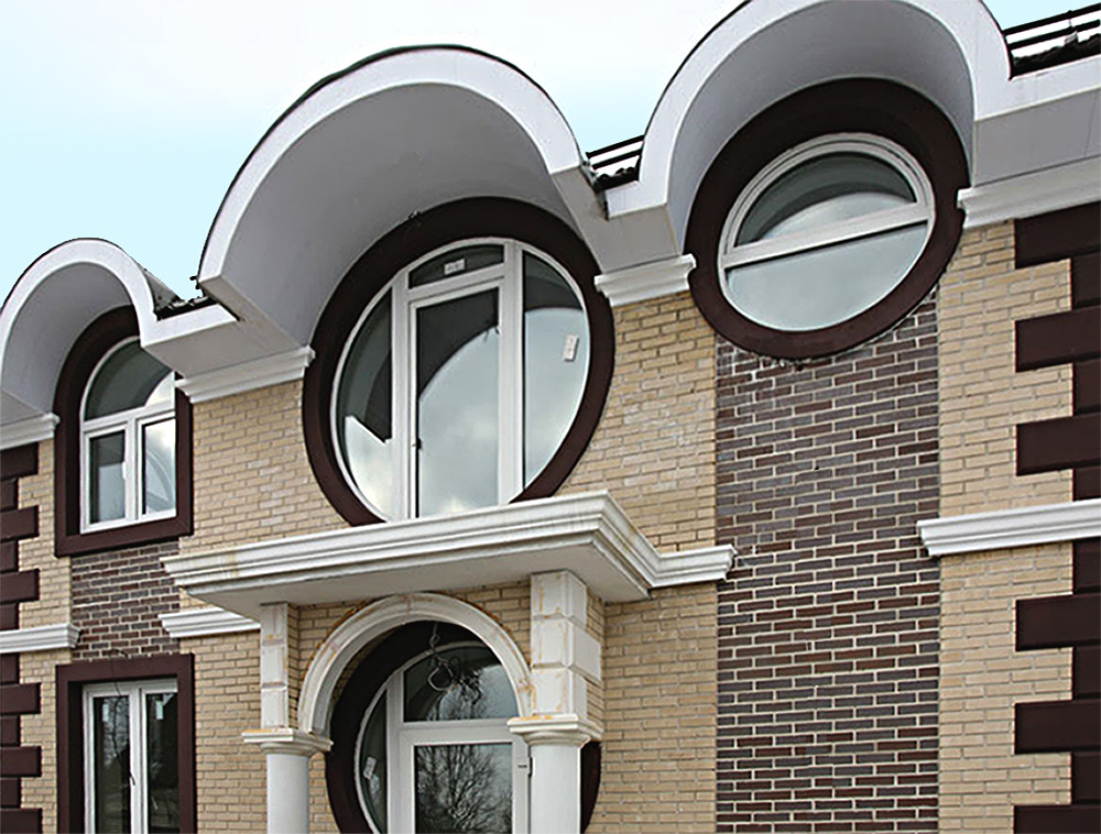 Фасад современного дома с круглыми окнами